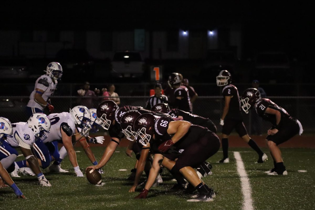 Brahmas and Tigers get set at the line of scrimmage.