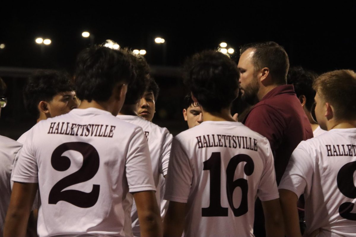 Brahma Soccer team in a team huddle