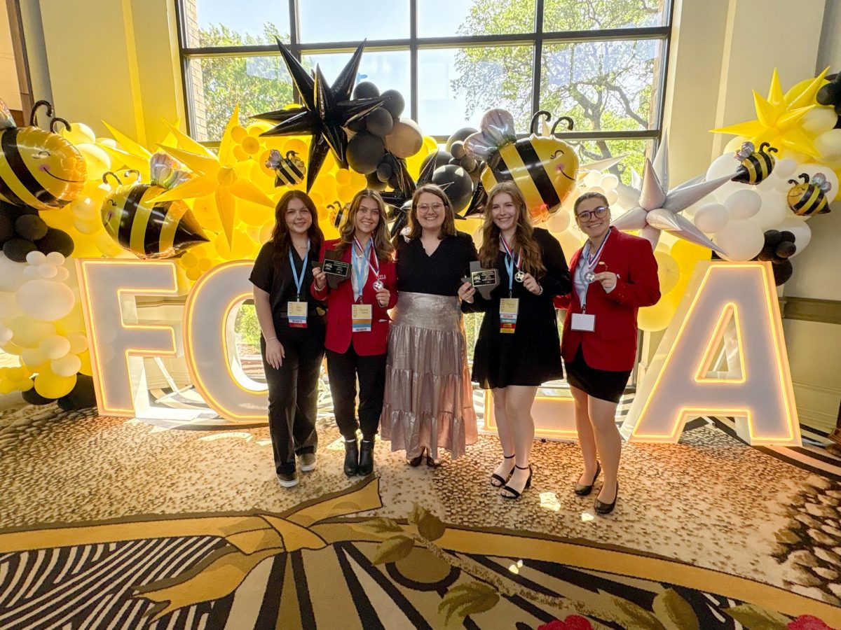 FCCLA state competitors showcase their awards.