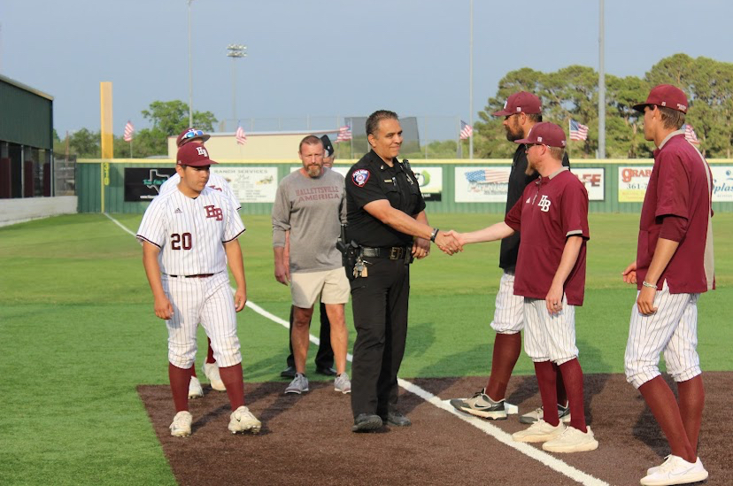 Lt. Rengel shakes hands with the coaching staff before the game.