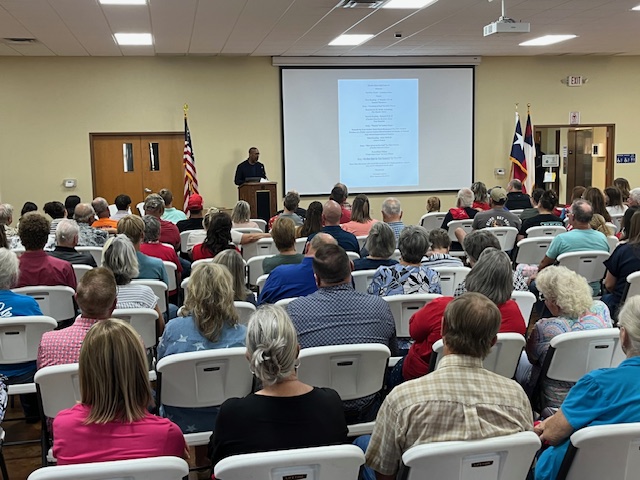 Dr. Robin Armstrong from Turning Point Faith speaking at the Lavaca County Vigil for Charlie Kirk on Sunday, September 21, 2025 at St. Peter's Lutheran Church Hall.
