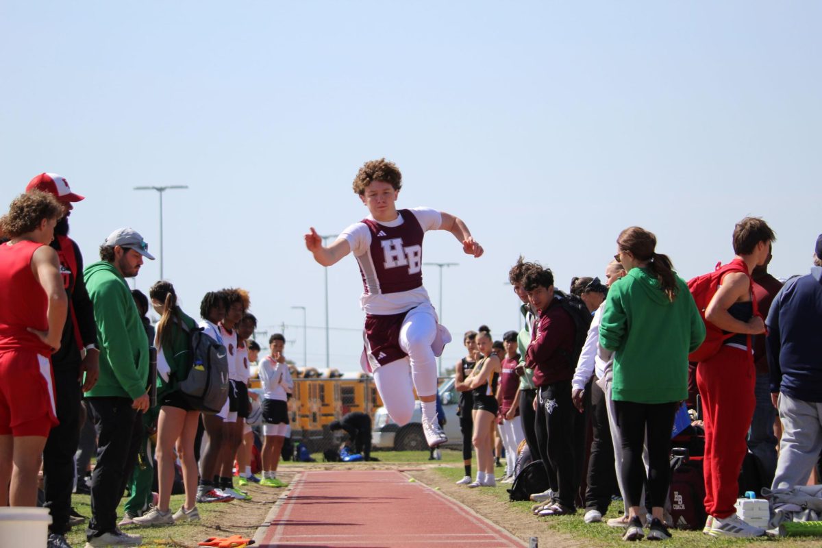 Zach Montgomery jumping at the track meet.