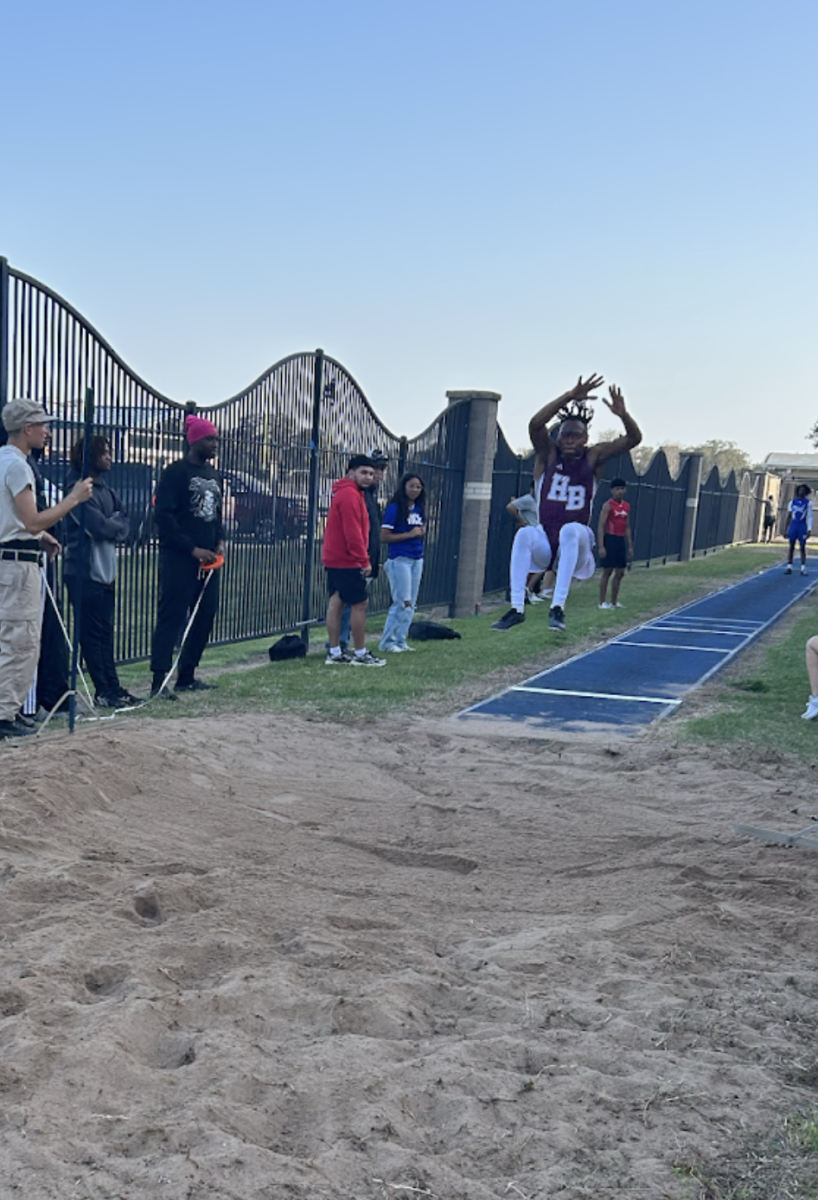 Savion Adams participating in Long jump. 