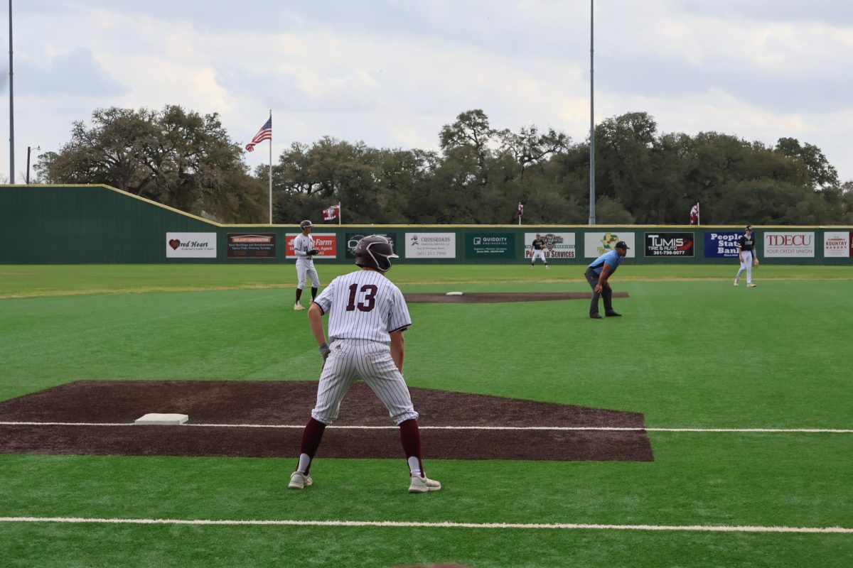 Number 13 is planning to steal home base at the Hallettsville Brahma Baseball Field